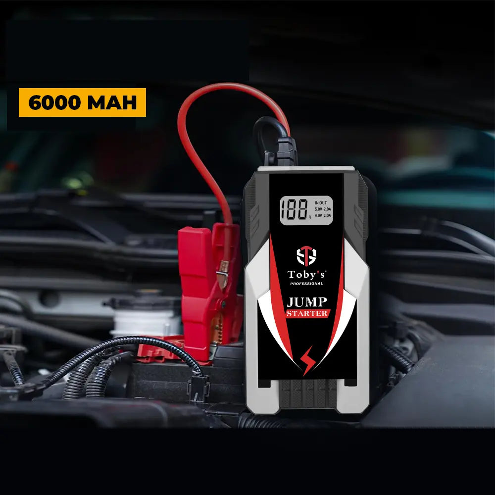 Toby's X6 6000mAh jump starter connected to car battery